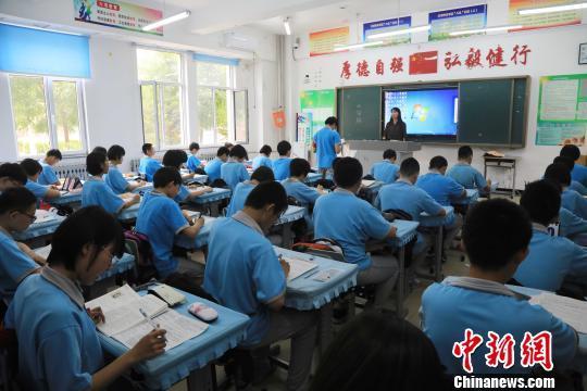资料图:学生上课中。沈殿成 摄 资料图:学生上课中。沈殿成 摄