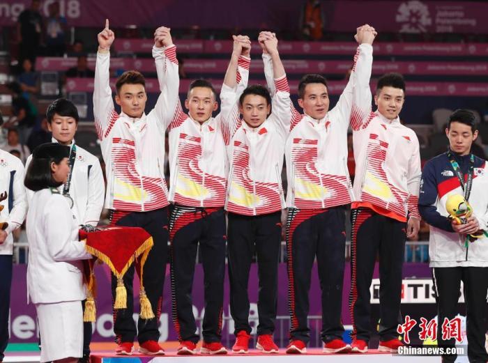资料图:当地时间8月22日进行的雅加达亚运会男子体操团体赛争夺中,以肖若腾、林超攀、邹敬园、邓书弟、孙炜组成的中国队以总成绩260.950分成功战胜日本,收获冠军。中新社记者 刘关关 摄 资料图:当地时间8月22日进行的雅加达亚运会男子体操团体赛争夺中,以肖若腾、林超攀、邹敬园、邓书弟、孙炜组成的中国队以总成绩260.950分成功战胜日本,收获冠军。/p中新社记者 刘关关 摄